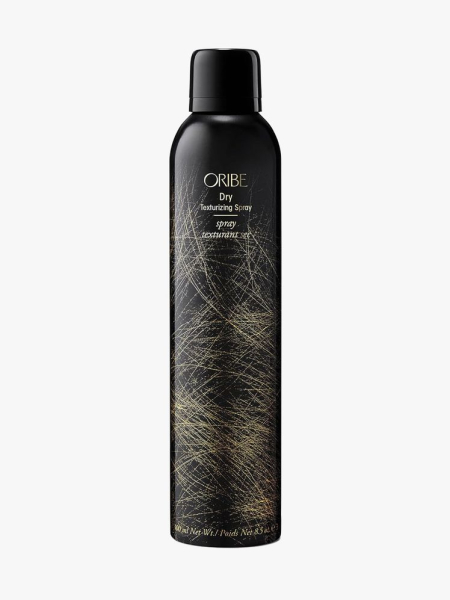 Oribe Dry Texturizing Spray in branded component on a light gray background